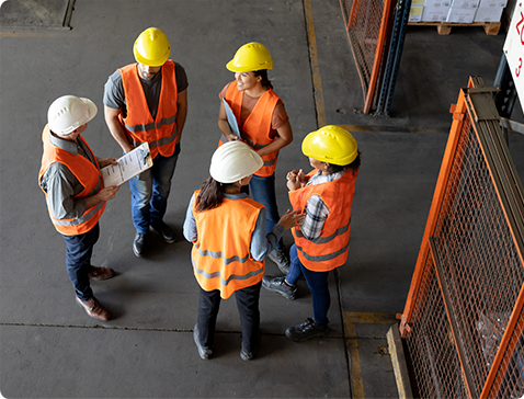 Warehouse workers meet together