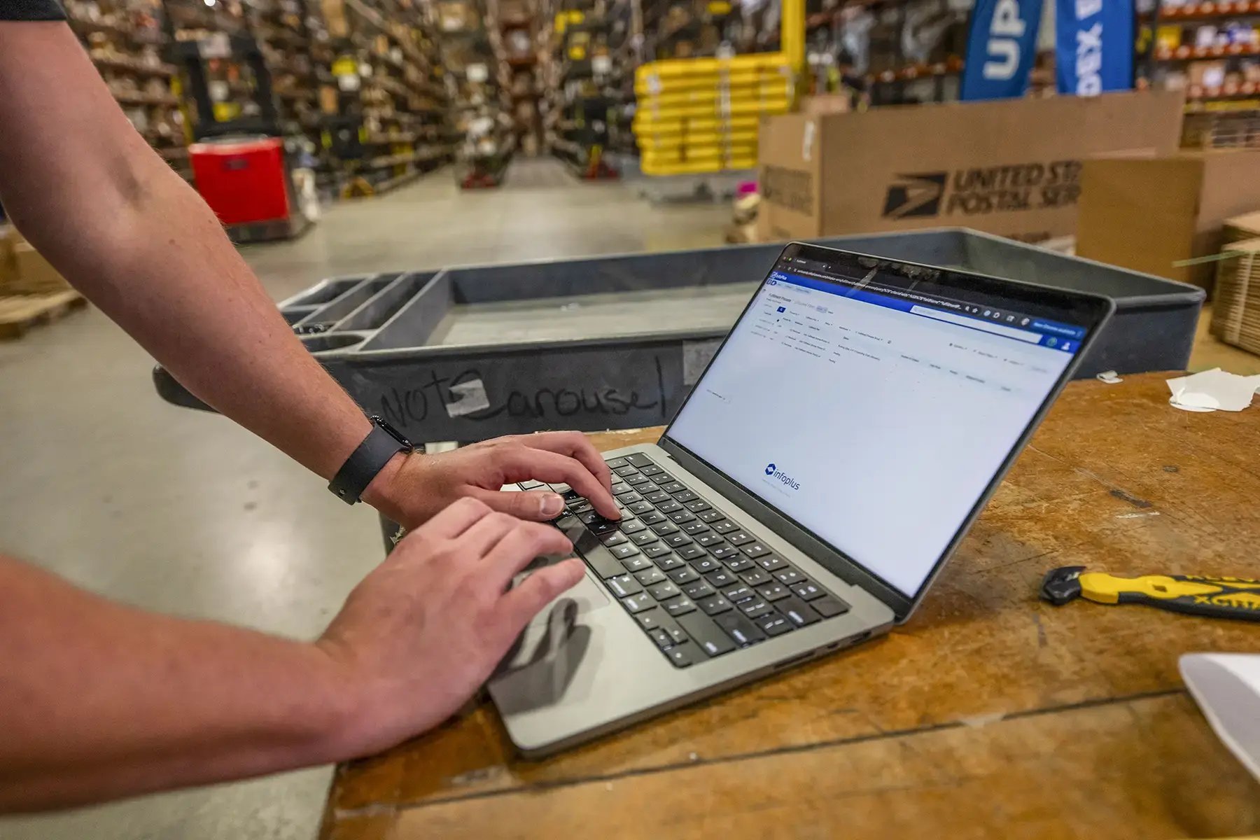 Warehouse worker using InfoPlus Warehouse Management Software