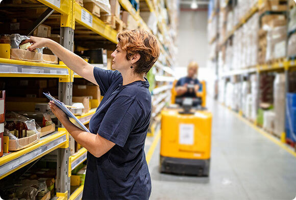 Warehouse works picks inventory for order