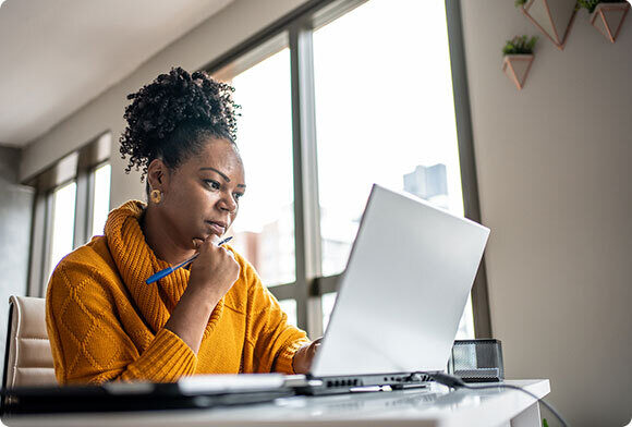 Woman uses computer in office