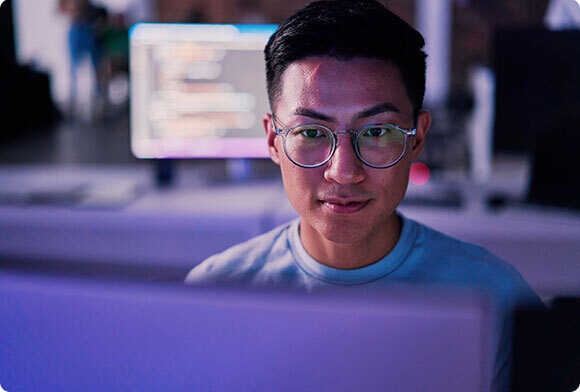 Man looks at data on computer