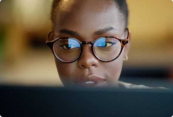 Woman looks at her computer
