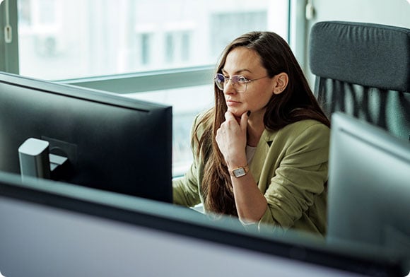 Woman checks her computer